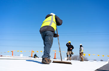 Man Cleaning Construction Site